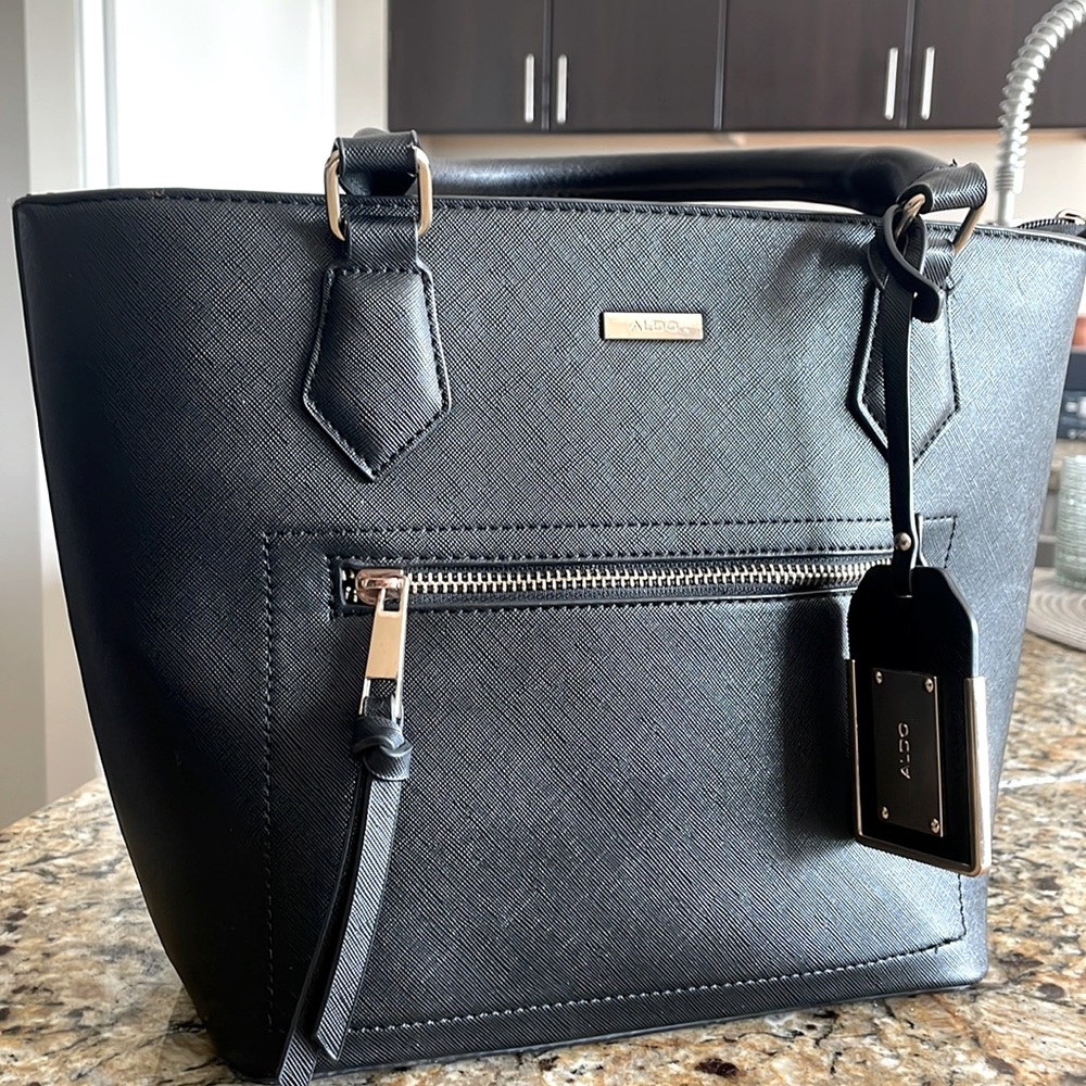 Black small tote. Great size for the office and going out. No scratches